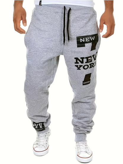 Pantalon de sport pour homme, coupe régulière, couleur unie, avec poches latérales et cordon de serrage, imprimé alphabet "NEW YORK", pantalon chic et décontracté pour hommes, parfait pour les activités en plein air.