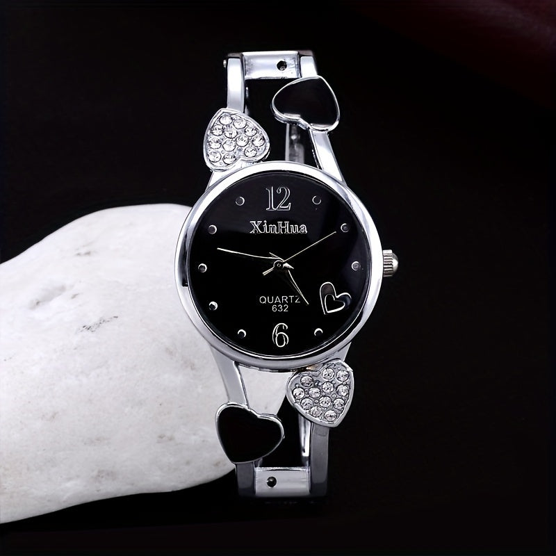 Round pointer quartz watch, rhinestone decorated dial, hollowed out heart detail on the watch strap 